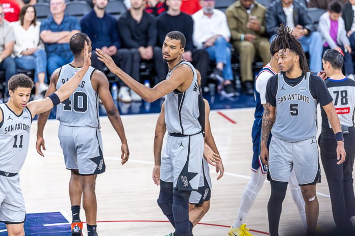 San Antonio Spurs (1) Wemby Wembanyama high five his teammates after a and 1 play at an NBA Basketball game vs Los Angeles Clippers at Intuit Dome in Inglewood California on March 16, 2026 - Photo Credit - BZFilms Sports Marketing Agency - Bruno De Witt Zanotto
