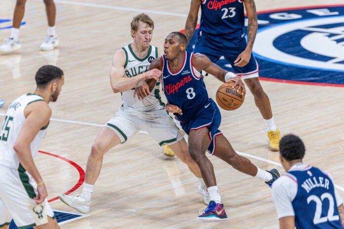Los Angeles Clippers Kris Dunn (8) dribbles the ball at an NBA game vs the Bucks at Intuit Dome in Inglewood California on March 23rd, 2026 - Photo Credit - BZFilms Sports Marketing Agency - Bruno De Witt Zanotto