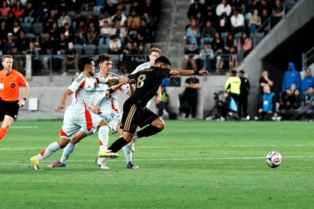 LAFC vs FC DALLAS 2026, Mark Delgado #8 breaking through two FC Dallas defenders on the attack. MLS match at BMO Stadium on 03/07/2026 (Photo By: Normando Mariscal for LAMOMENTUM