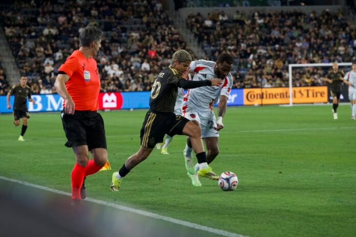 LAFC vs FC DALLAS 2026, David Martinez #30 going up against Sebastian Ibeagha #25. MLS match at BMO Stadium on 03/07/2026 (Photo By: Normando Mariscal for LAMOMENTUM