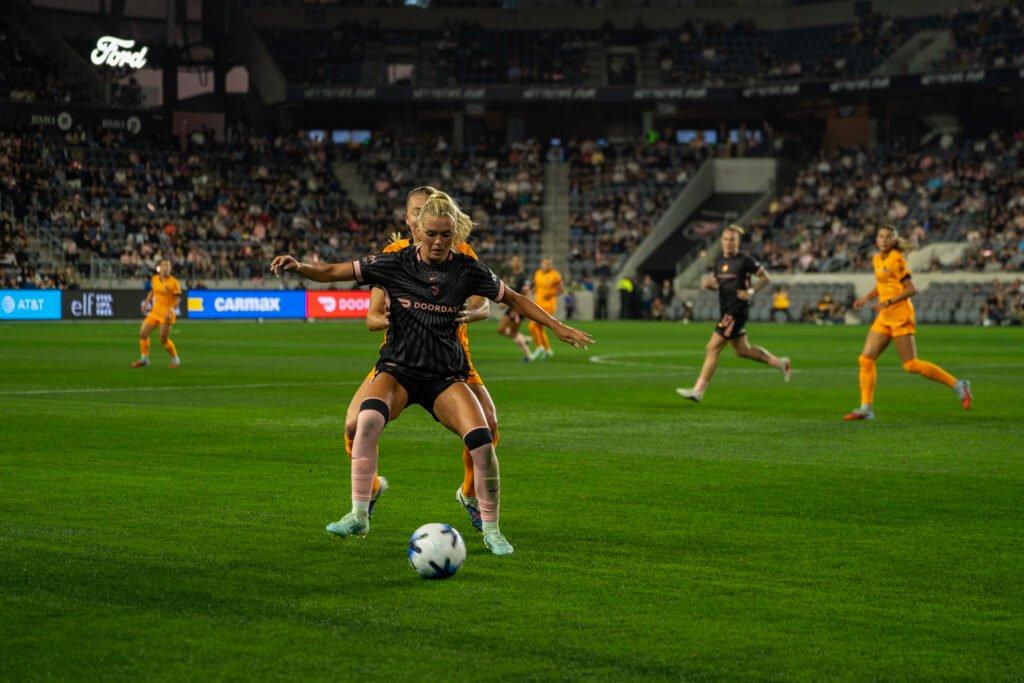 Angel City FC forward Riley Kiernan covering the ball vs Houston Dash at BMO Stadium on March 27th, 2026 - Photo Credit - Henry Caceres for LAMomentum.