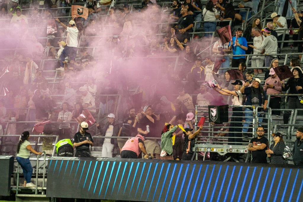 Angel City FC Supporter Group lighting pink smoke flares vs Houston Dash at BMO Stadium on March 27th, 2026 - Photo Credit - Henry Caceres for LAMomentum.