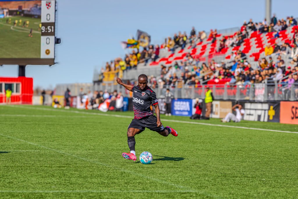 Loudoun United FC Kwame Awuah (6) crossing the ball at a USL Championship game vs Pittsburgh Riverhounds SC at Segra Field in Loudoun, Virginia on March 14th, 2026 - Photo Credits - Omar Yair Soto with LAMomentum