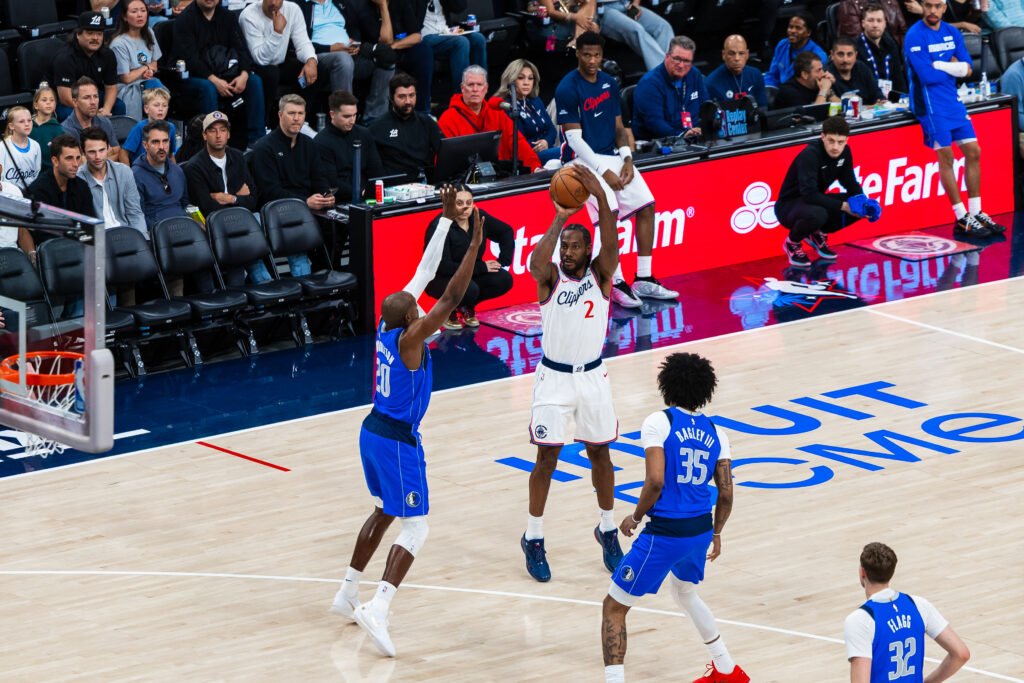 Los Angeles Clippers Kawhi Leonard (2) shooting over two defenders vs Dallas Mavericks at Intuit Dome in Inglewood, CA, April 7, 2026 - Photo Credit- Ethan Lee