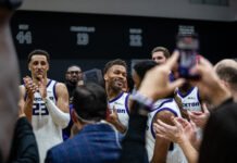 Dexter Dennis (#9) for the Stockton Kings lifting the trophy, honoirng their win in the Western Conference against the South Bay Lakers on April 5, 2026. Photo Credit: Daisy Lopez