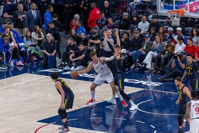 Los Angeles Clippers Brook Lopez (11) dribbles the ball at an NBA regular season game vs the Golden State Warriors at Intuit Dome in Inglewood California on April 12, 2026 - Photo Credit - BZFilms Sports Marketing Agency - Bruno De Witt Zanotto