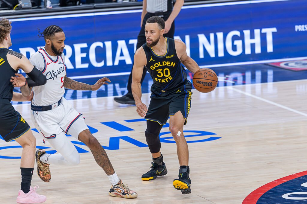 Golden State Warriors Stephen Curry (30) dribbles the basketball at an NBA basketball game vs The Los Angeles Clippers at Intuit Dome in Inglewood California on April 12, 2026 - Photo Credit - BZFilms Sports Marketing Agency - Bruno De Witt Zanotto