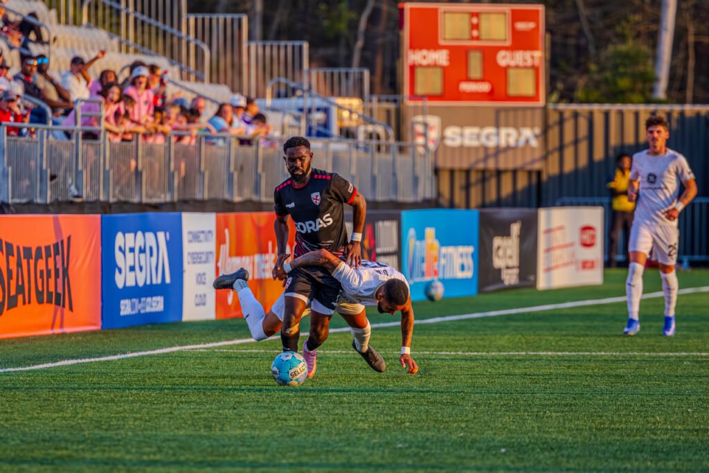 Loudoun United FC Pacifique Niyongabire (7) breaking through a tackle and pushing down the line at a USL Championship game vs Louisville City FC at Segra Field in Loudoun, Virginia on April 10th 2026 - Photo Credits - Omar Yair Soto with LAMomentum