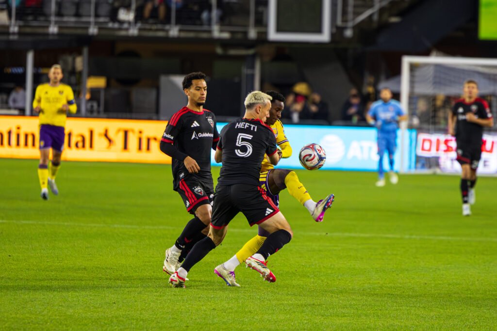 DC United's Silvan Hefti (5) pressuring Orlando City attacker in a MLS game at Audi Field in Washington DC on April 25th 2026. Photo Credits - Omar Yair Soto