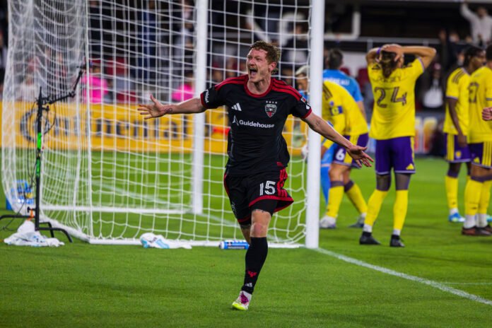 DC United's Kye Rowles celebrating a header to win the game at Audi Field against Orlando City in a MLS game in Washington DC on April 25th, 2026. Photo Credits - Omar Yair Soto with LAMomentum