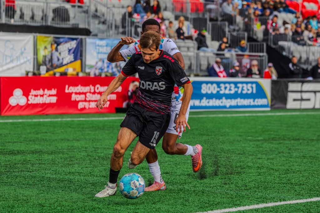 Loudoun United's Richard Aman (19) pushes into the box against Oakland defender into the box at a USL Championship game at Segra Field in Loudoun, Virginia on May 2nd 2026. Photo Credits Omar Yair Soto with LAMomentum