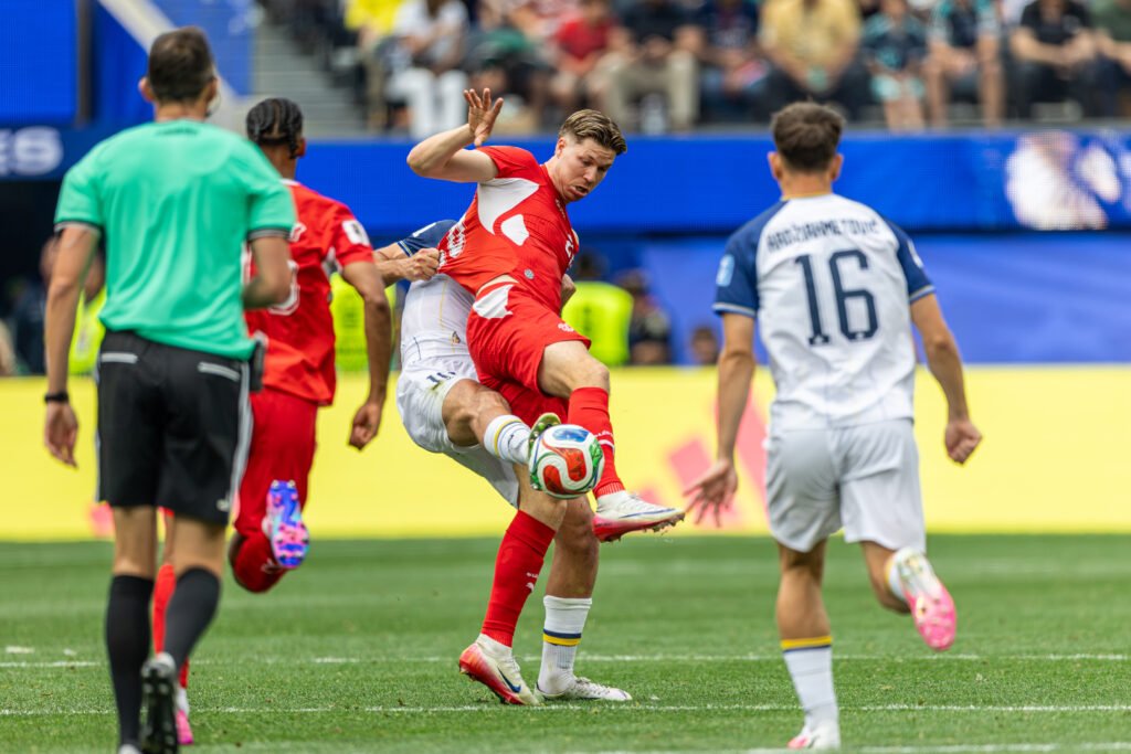 Switzerland player fights for the ball vs Serbian player at a World Cup match at Sofi Stadium in Inglewood California on Thursday, June 18th, 2026 - Photo Credit - Bruno De Witt Zanotto BZFILMS Sports Marketing Agency