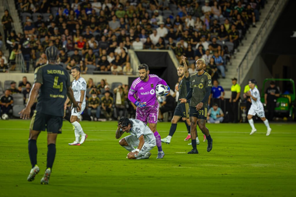 The tension rises after Querétaro FC scores as LAFC's Hugo Lloris (1) makes contact with Enzo Giménez (16) on Wednesday night at BMO Stadium in Los Angeles, CA - photo by Adrian Perez