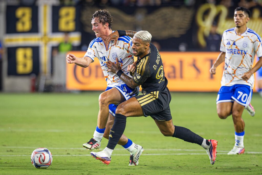 LAFC's frustration shows through Denis Bouanga (99) as Oscar Verhoeven (33) takes the ball away for San Diego FC on Saturday night at BMO Stadium in Los Angeles, CA - photo by Adrian Perez