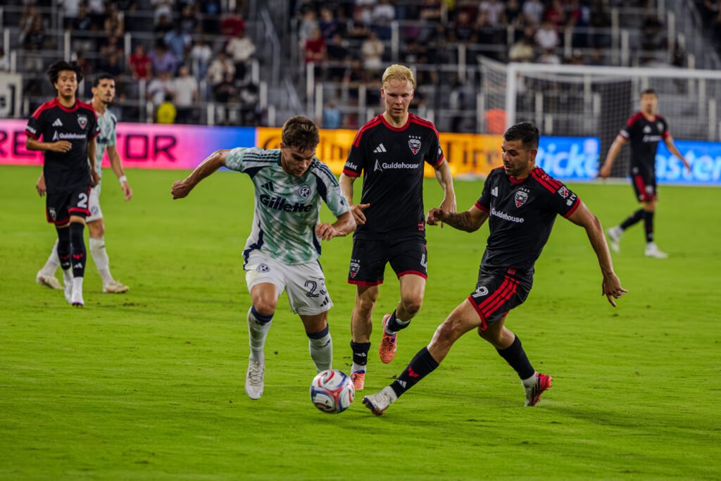 MLS - New England Revolution's defender William Sands #23 getting past DC United's Tai Baribo #9 in a MLS game at Audi Field on August 19th 2026. Photo Credits - Omar Yair Soto