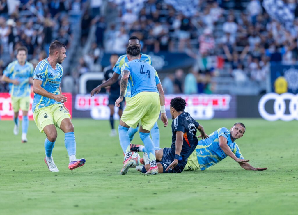 The Philadelphia Union defense swarms San Diego FC winger Elias Achouri (99) in a battle for possession on Sunday night at Snapdragon Stadium in San Diego, CA - photo by Adrian Perez