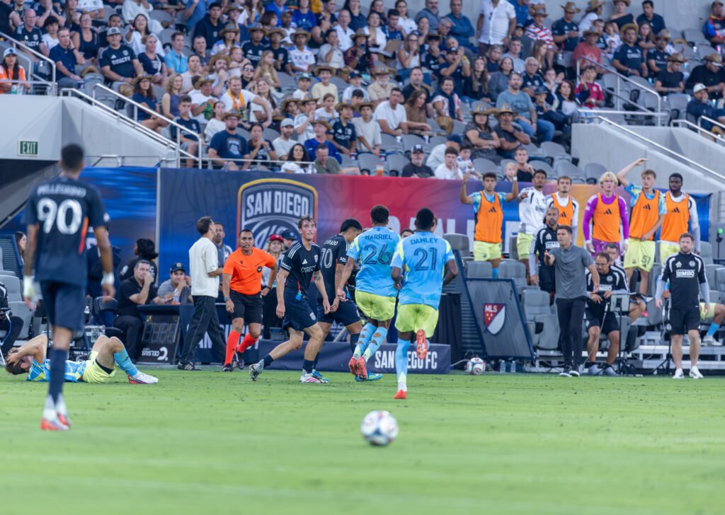 Nathan Harriel (26) and Jean Jacques Danley (21) of the Philadelphia Union react to a tense first-half sequence where San Diego FC's Alejandro Alvarado (70) commits a yellow card foul on Sunday night at Snapdragon Stadium in San Diego, CA - photo by Adrian Perez