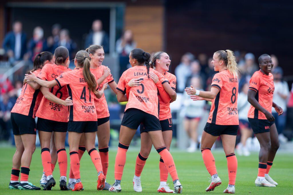 Karlie Lema celebrates Bay FC’s second goal with Alex Pfeiffer against Racing Louisville FC at PayPal Park.