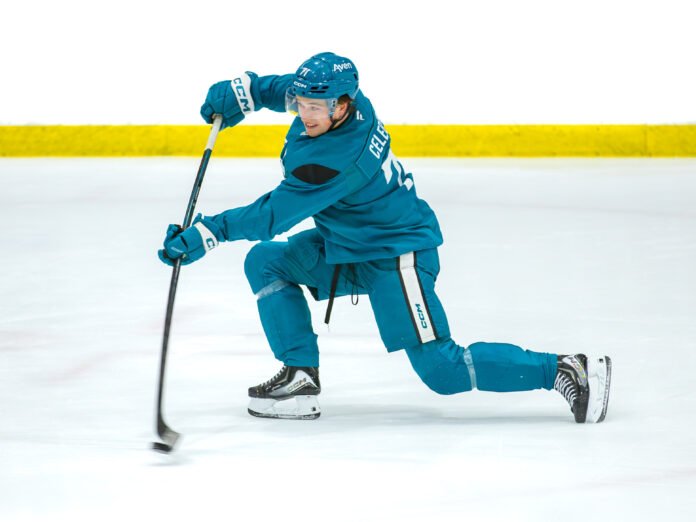 Macklin Celebrini #71 shoots the puck during San Jose Sharks training camp