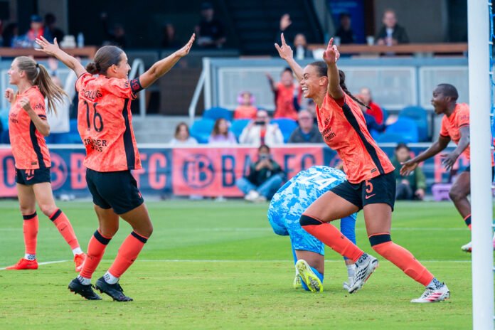 Karlie Lema celebrates her goal as she runs toward Bay FC captain Sydney Collins during the match against Racing Louisville FC.