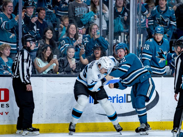 San Jose Sharks forward Carson Wetsch (#62) and Utah Mammoth defenseman Gregor Biber (#75) exchange punches during a Rookie Faceoff game at Tech CU Arena in San Jose.