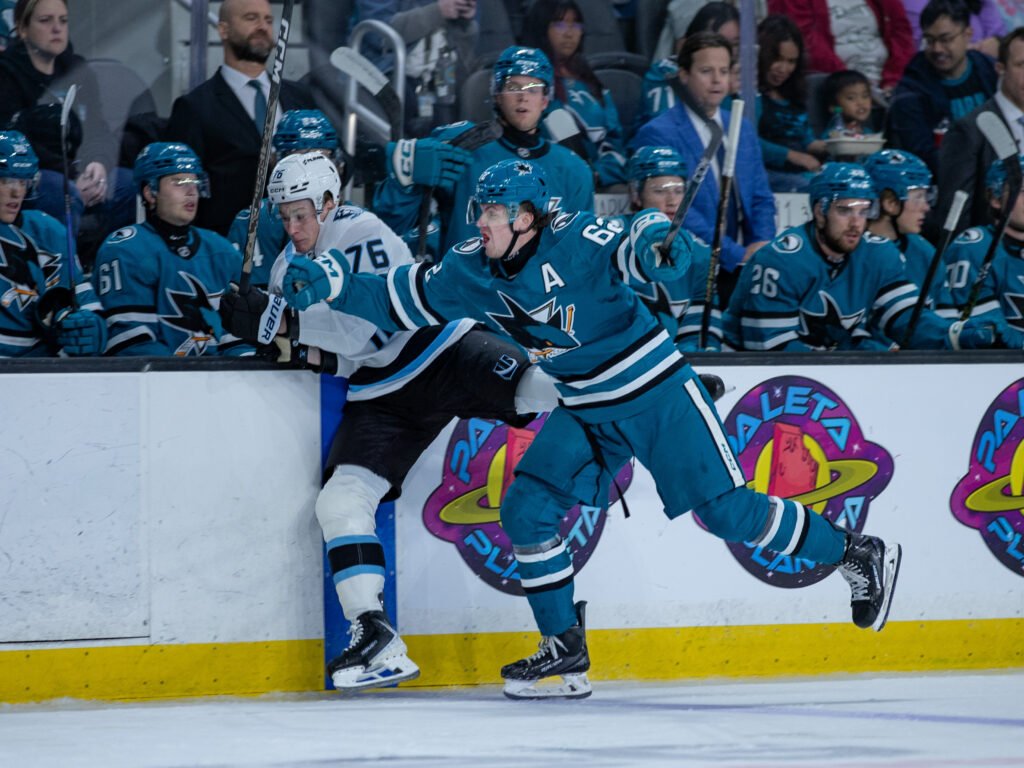 San Jose Sharks forward Carson Wetsch (#62) battles Utah Mammoth forward Vadim Moroz (#76) along the boards during the 2026 Rookie Faceoff at Tech CU Arena in San Jose.