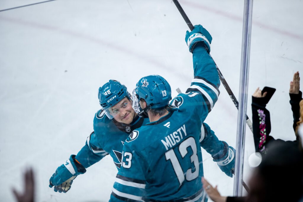 Quentin Musty (#13) celebrates with Eric Pohlkamp (#48) after scoring the final goal of San Jose’s 3–1 win over the Utah Mammoth during the 2026 Rookie Faceoff.