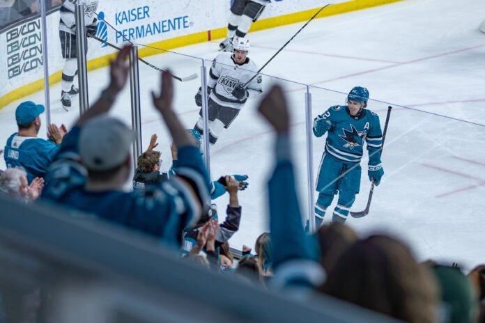 Carson Wetsch celebrates with San Jose Sharks fans after a goal against the Los Angeles Kings during the 2026 Rookie Faceoff.