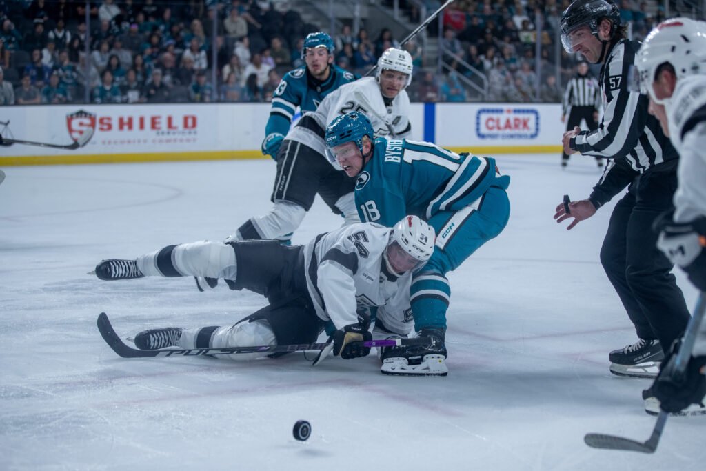 Filip Bystedt of the San Jose Sharks battles Jimmy Lombardi of the Los Angeles Kings during the 2026 Rookie Faceoff.