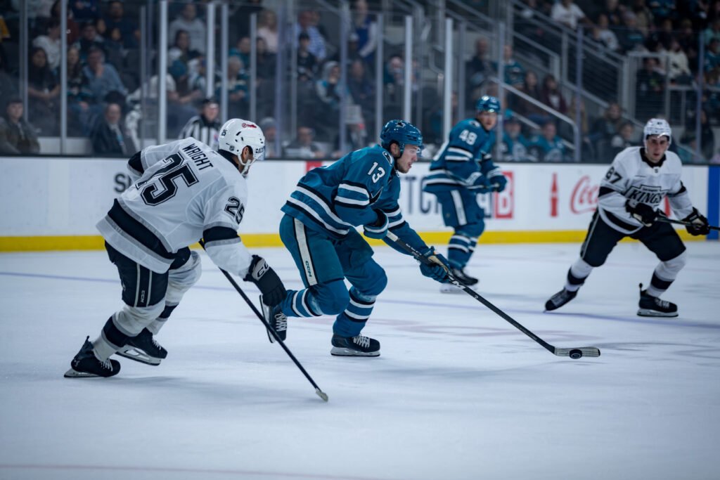 Quentin Musty of the San Jose Sharks battles Jared Wright of the Los Angeles Kings during the 2026 Rookie Faceoff.