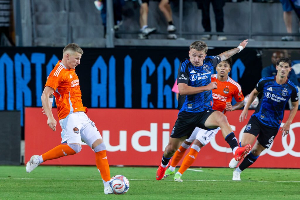 San Jose Earthquakes and Houston Dynamo FC players battle for possession during their MLS match at PayPal Park.