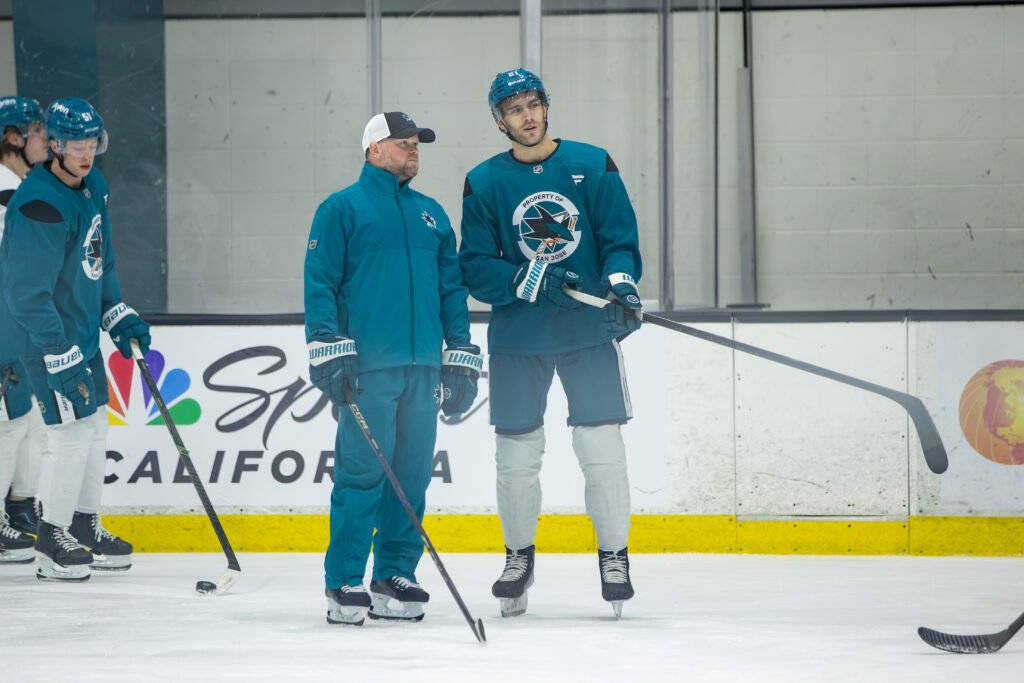 Alexander Wennberg (#21) with San Jose Sharks head coach Ryan Warsofsky during Training Camp.