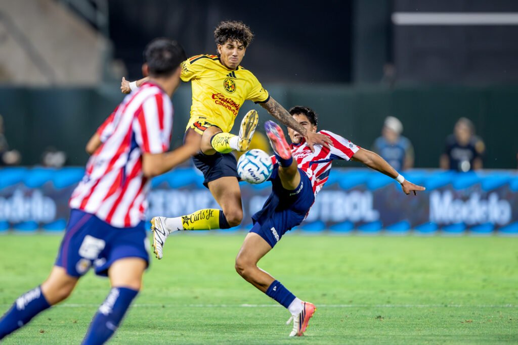 Chivas de Guadalajara and Club América players battle for the ball during El Clásico de México in Oakland.
