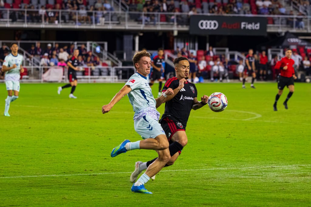 International Club Friendly - SC Paderborn 07's defender #2 Müller, clearing a opportunity for DC United's João Peglow #7 at Audi Field in a International Club Friendly in Washington DC on September 30th 2026. Photo Credits - Omar Yair Soto