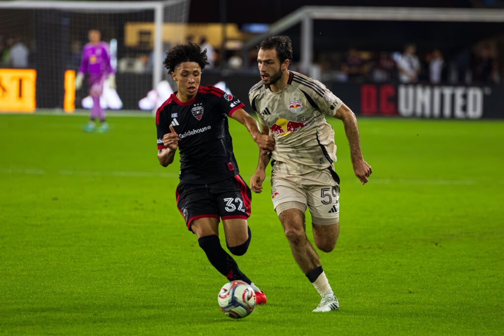 MLS - DC United's Oscar Avilez #32 chasing down Red Bull's Devin Padelford #59 down the line in a MLS game at Audi Field in Washington DC, on October 14th 2026. Photo Credits - Omar Yair Soto