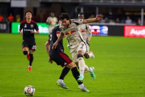 MLS - Red Bull New York's Cade Cowell #7 getting through DC United defender Silvan Hefti #5 in a MLS game at Audi Field in Washington DC on October 14th, 2026. Photo Credits - Omar Yair Soto