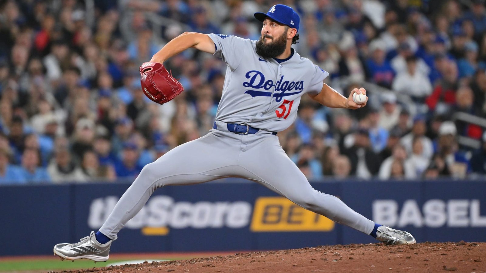 Alex Vesia pitching in his Dodgers road uniform