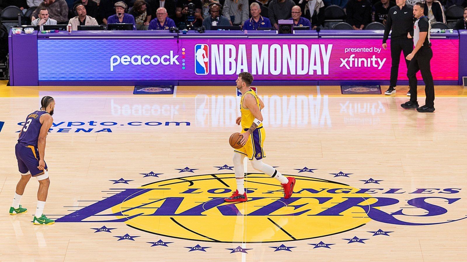 Luka Doncic with the ball at center court against the Phoenix Suns at Crypto.com Arena